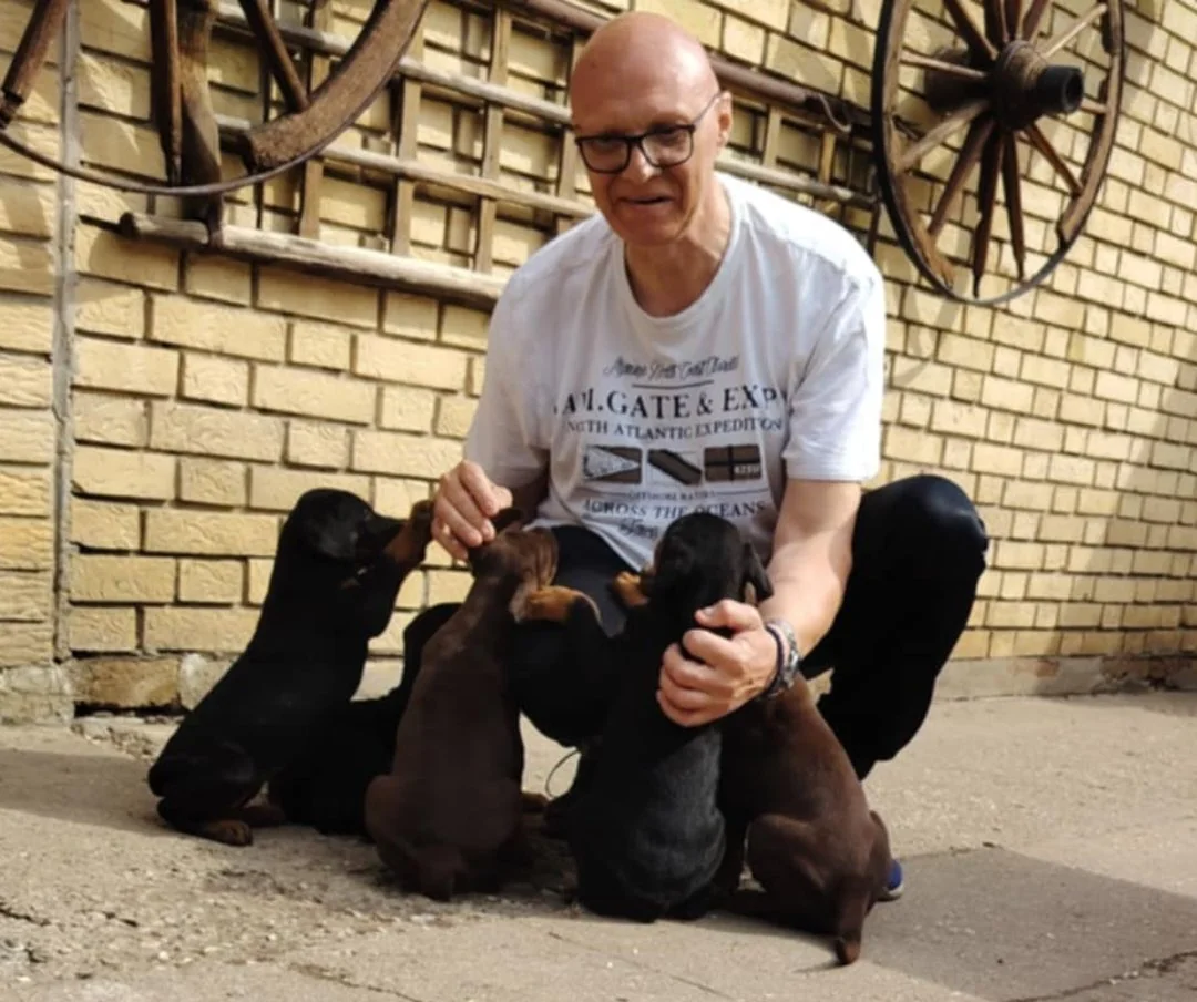 Milan Rudović with a Dobermann